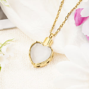 Gold heart pendant with white stone for ashes
